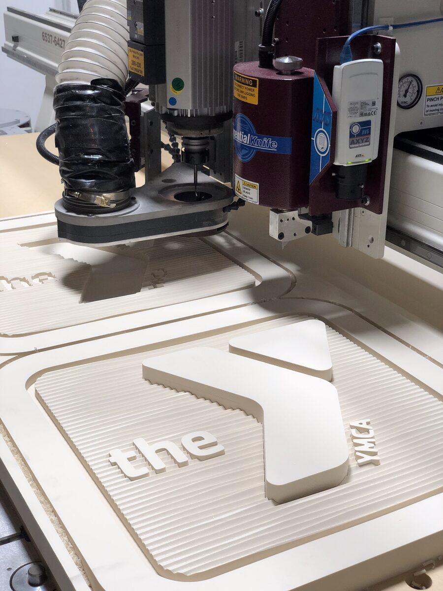 HDU sign panel being carved on our CNC router — CG Signs Jacksonville FL